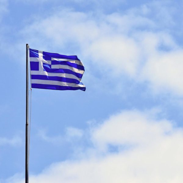 flag-greece-flying-wind-blue-sky-summer-background-travel-holidays-greece-crete